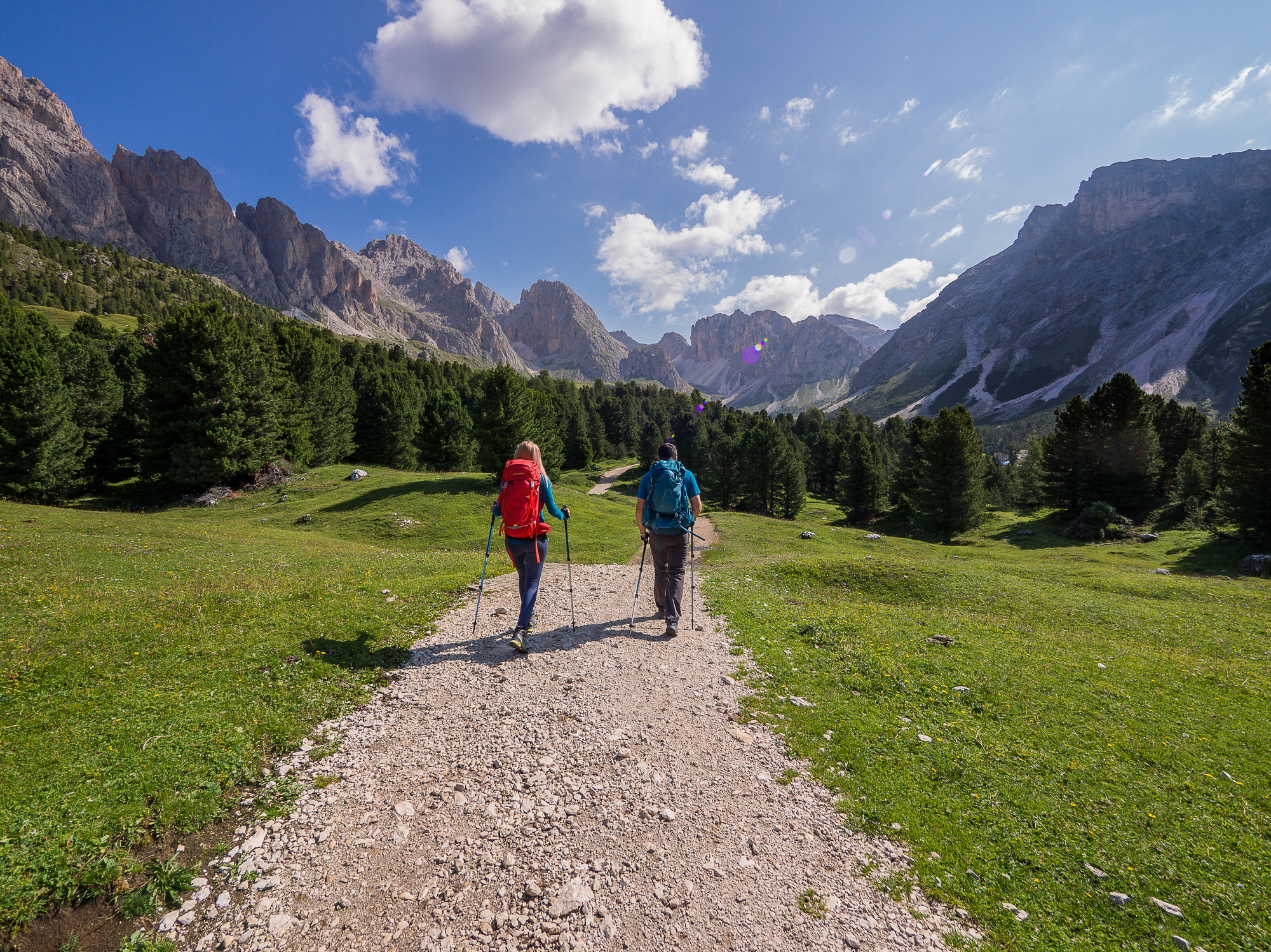 A couple of hikers along a path in the Dolomites